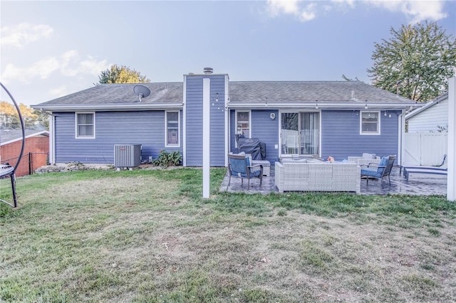 back of property featuring a patio area, a lawn, cooling unit, and an outdoor hangout area