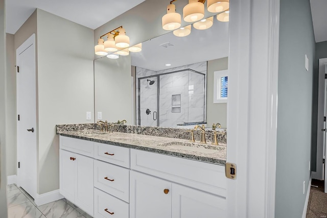 bathroom with vanity and an enclosed shower