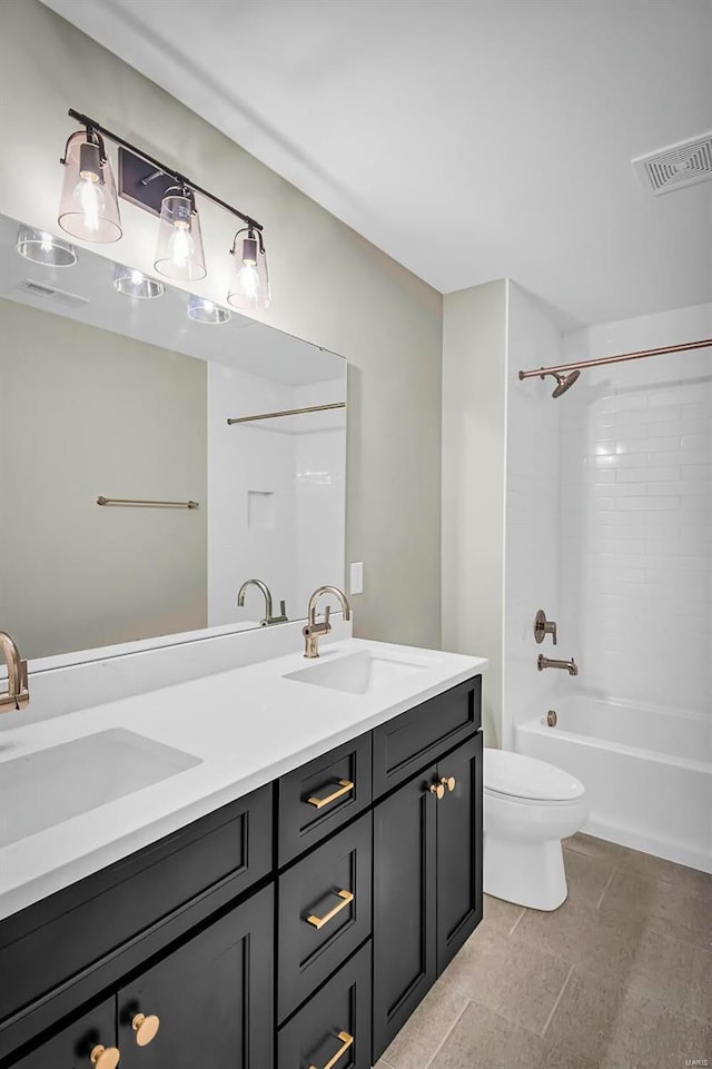 full bathroom featuring shower / bathtub combination, vanity, and toilet