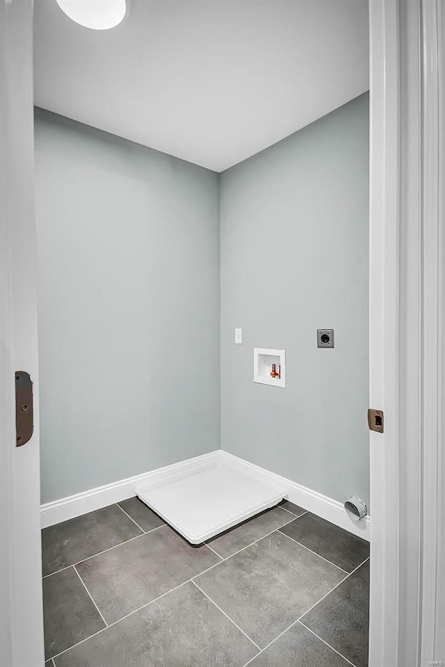 laundry area with hookup for a washing machine, dark tile patterned floors, and hookup for an electric dryer