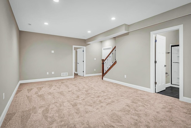 basement featuring dark carpet