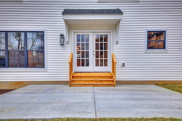 property entrance featuring french doors and a patio