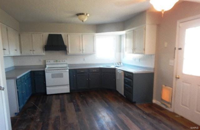 kitchen featuring ventilation hood, sink, white cabinets, white electric range, and dark hardwood / wood-style floors