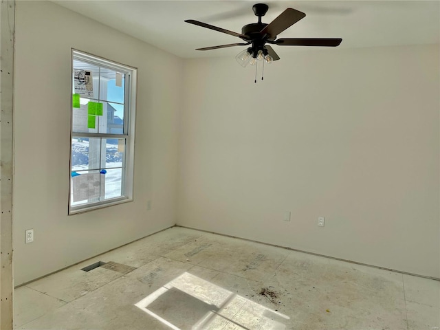 unfurnished room with ceiling fan