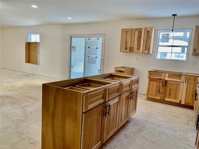 kitchen featuring a wealth of natural light and pendant lighting