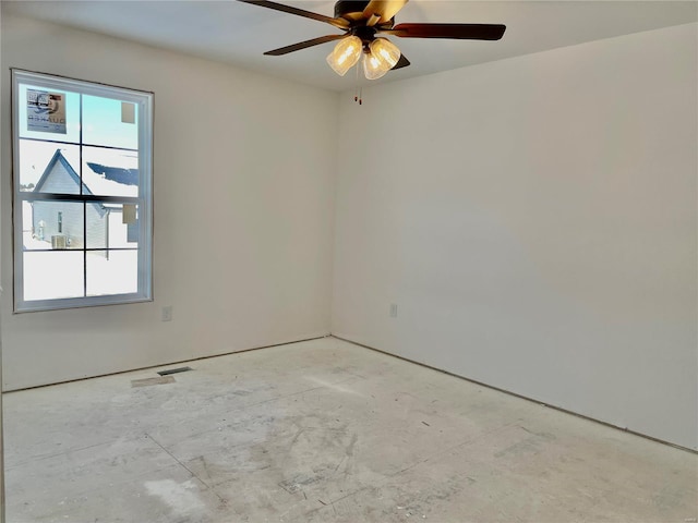 spare room featuring a wealth of natural light and ceiling fan