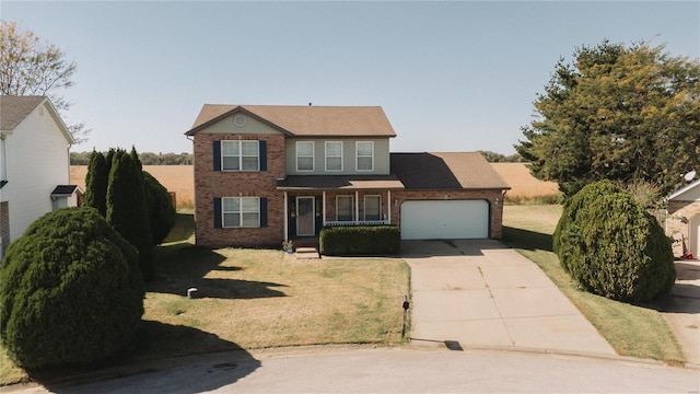 view of front of house featuring a garage and a front lawn