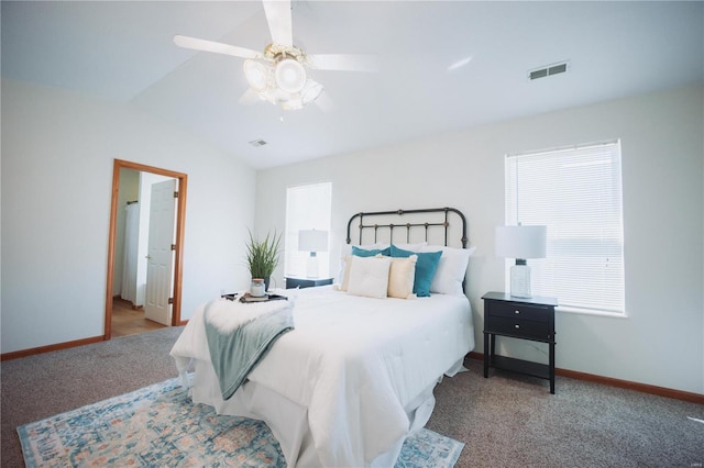 carpeted bedroom featuring ceiling fan and vaulted ceiling