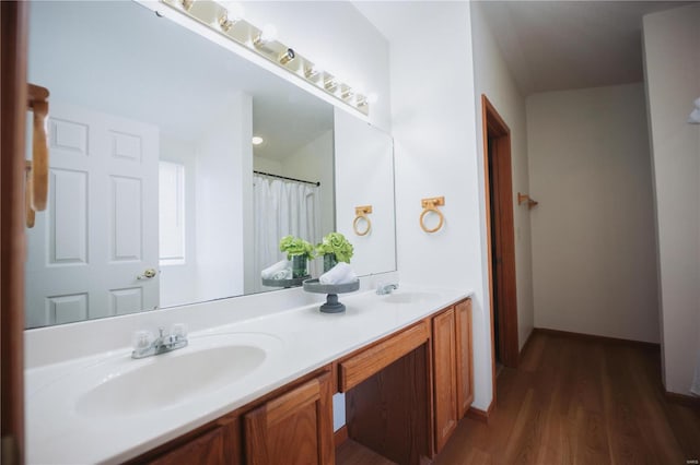 bathroom with vanity and hardwood / wood-style flooring