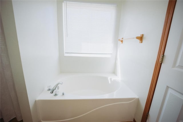 bathroom featuring a tub