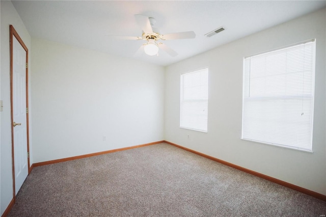 carpeted empty room with ceiling fan