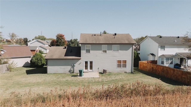 back of house featuring a yard and a patio area