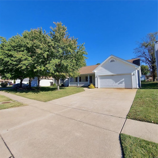 view of front of home with a front lawn and a garage