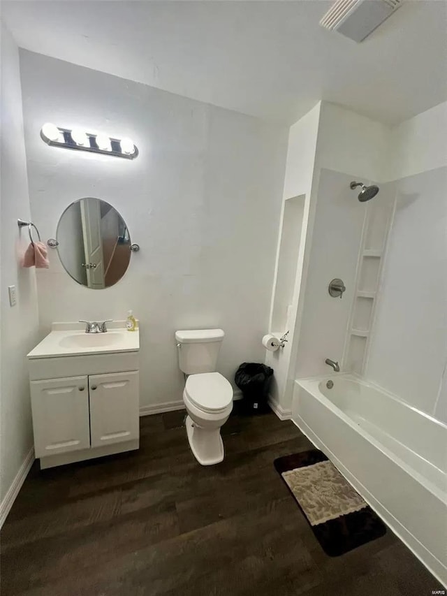 full bathroom with toilet, shower / tub combination, vanity, and wood-type flooring