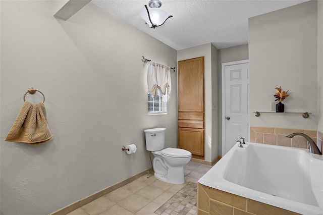 bathroom featuring toilet, a textured ceiling, tiled tub, and tile patterned flooring