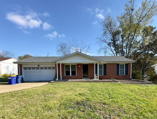 ranch-style house featuring a porch, a garage, and a front lawn