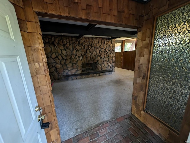 basement with wood walls and dark carpet