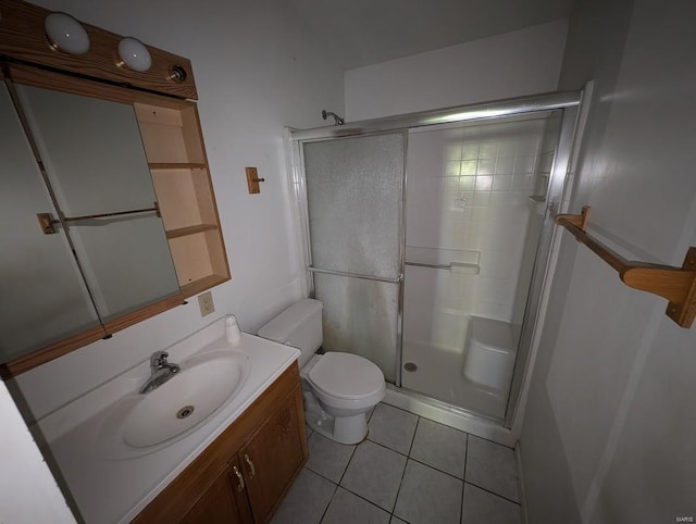 bathroom featuring an enclosed shower, tile patterned floors, vanity, and toilet