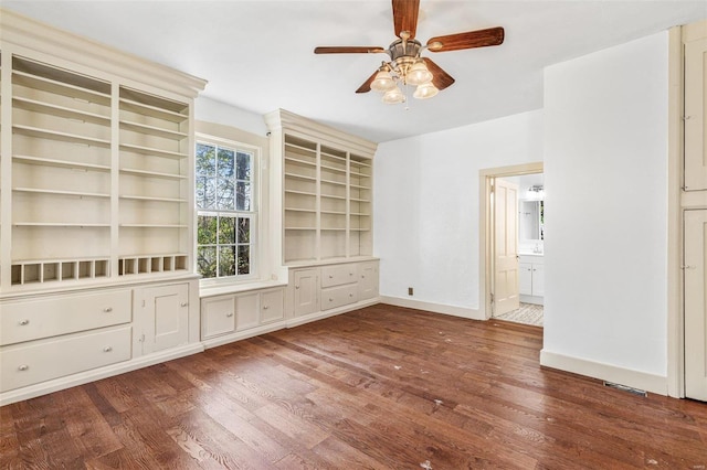 unfurnished living room with ceiling fan and wood-type flooring