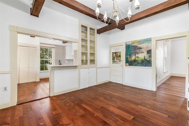 kitchen featuring decorative backsplash, white cabinetry, beamed ceiling, and dark hardwood / wood-style flooring