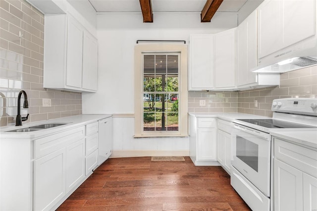 kitchen with sink, white electric stove, beamed ceiling, white cabinets, and dark hardwood / wood-style floors