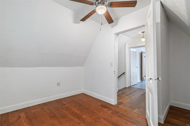 additional living space featuring hardwood / wood-style floors, vaulted ceiling, and ceiling fan