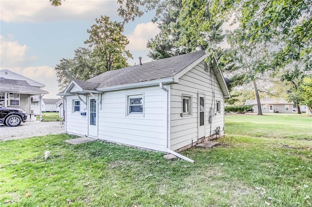 view of outbuilding with a lawn