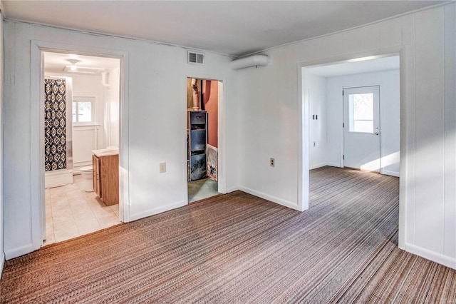 empty room featuring light carpet