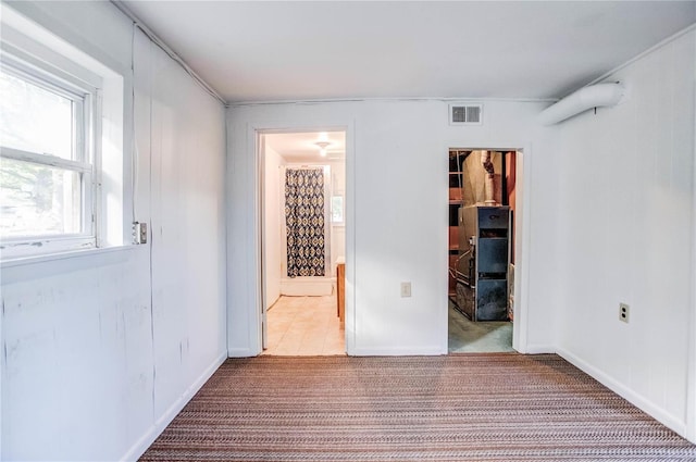 carpeted spare room with ornamental molding