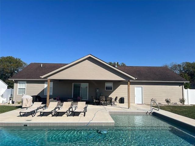 back of property with a patio