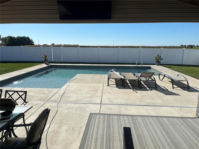 view of swimming pool featuring a patio area