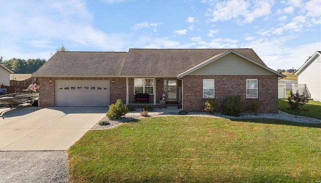 ranch-style house featuring a garage and a front lawn