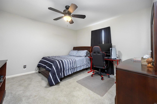 bedroom with light colored carpet and ceiling fan