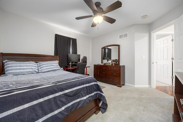 bedroom featuring light colored carpet and ceiling fan