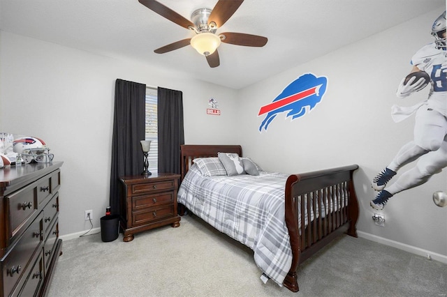 bedroom featuring light colored carpet and ceiling fan