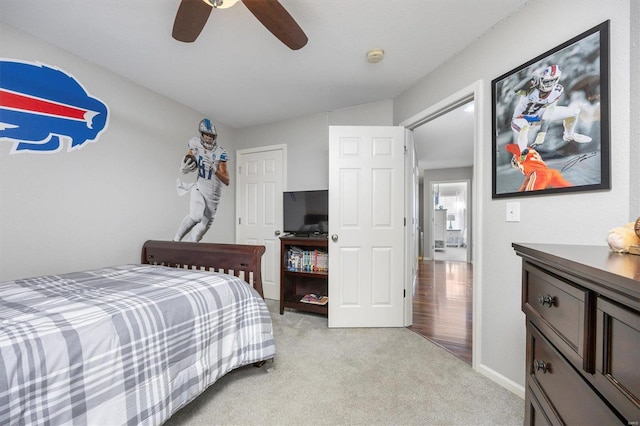 carpeted bedroom with a closet and ceiling fan