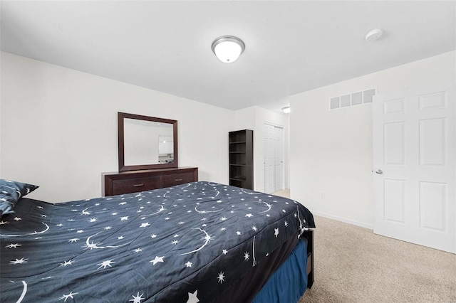 carpeted bedroom featuring a closet