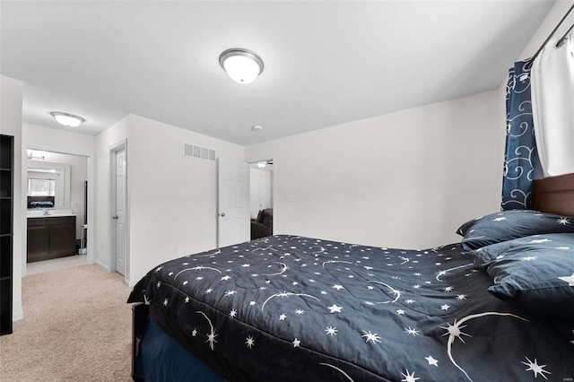 bedroom featuring light colored carpet