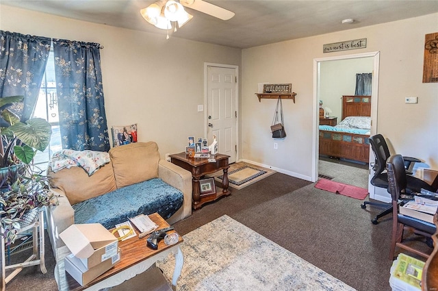 carpeted living room featuring ceiling fan