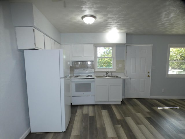 kitchen featuring white cabinets, sink, white appliances, and decorative backsplash