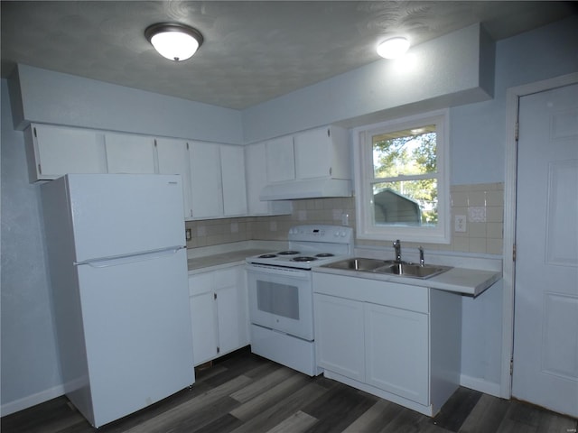 kitchen with tasteful backsplash, white appliances, white cabinets, and sink