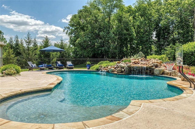 view of swimming pool with a fenced in pool, a patio, and fence