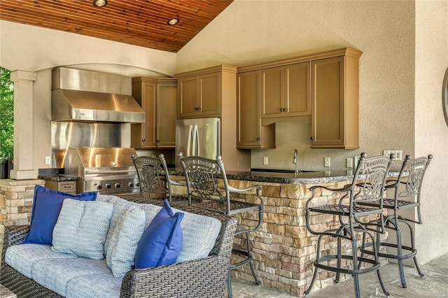 view of patio / terrace featuring an outdoor kitchen, outdoor wet bar, a sink, and a grill