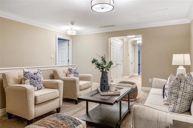 living room with visible vents, baseboards, attic access, ornamental molding, and light carpet