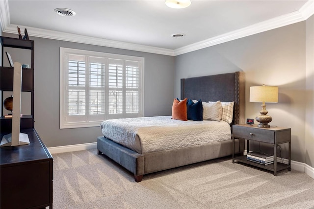 carpeted bedroom with visible vents, baseboards, and ornamental molding