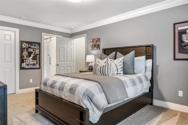 bedroom with visible vents, baseboards, carpet, and crown molding