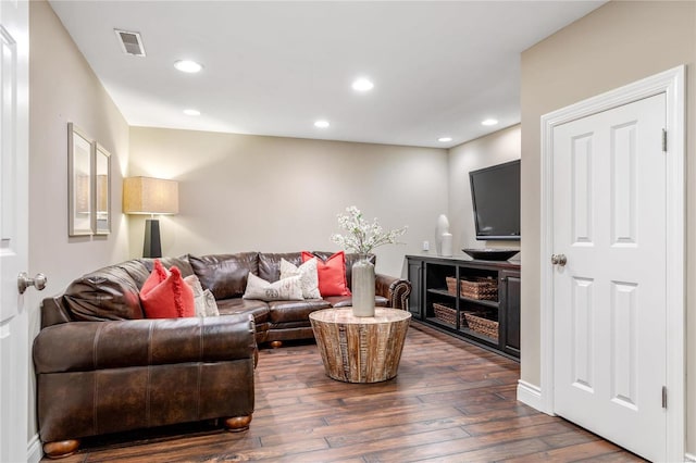 living area with visible vents, recessed lighting, and dark wood-style flooring