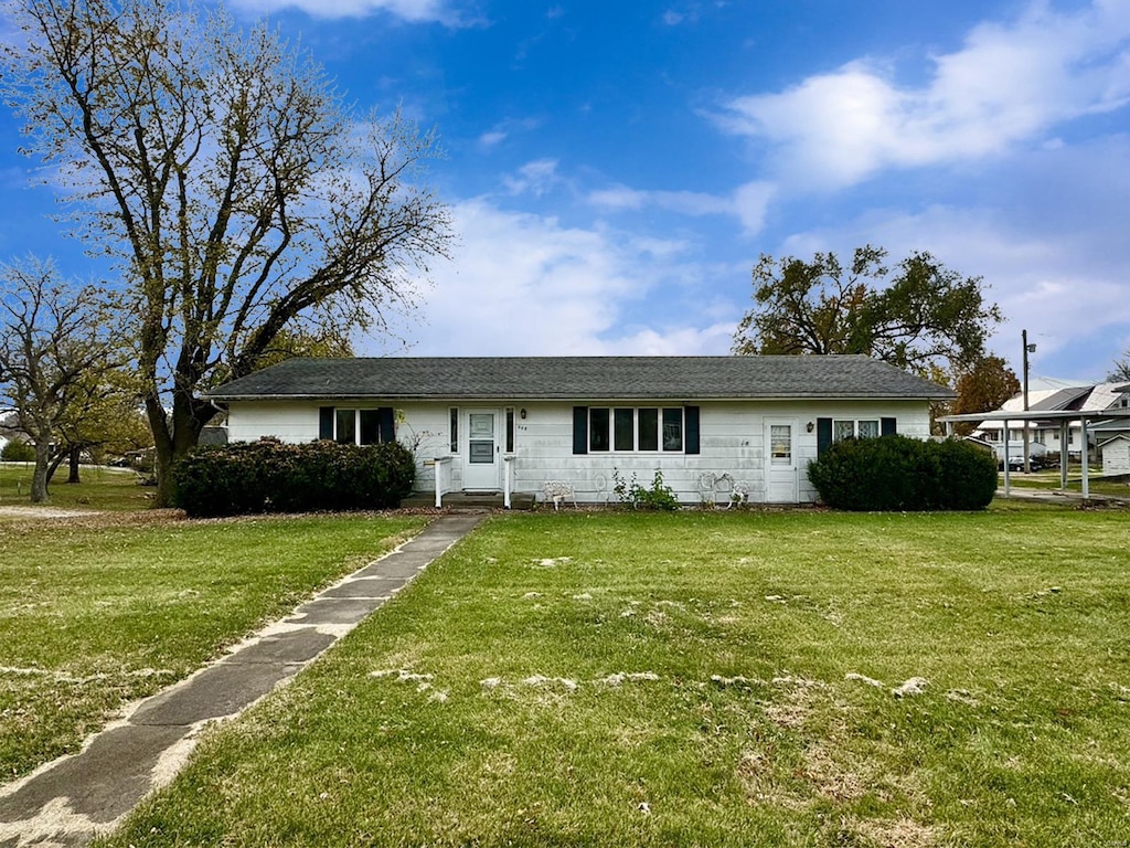 ranch-style house with a front yard