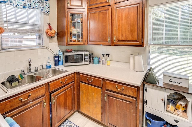 kitchen featuring sink and backsplash