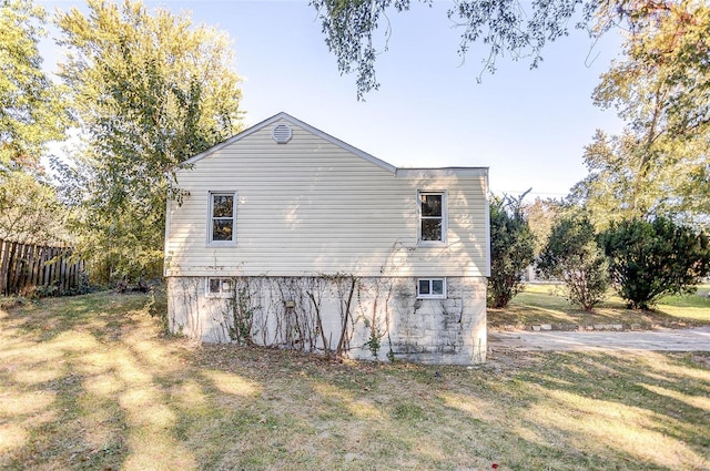 view of home's exterior featuring a yard